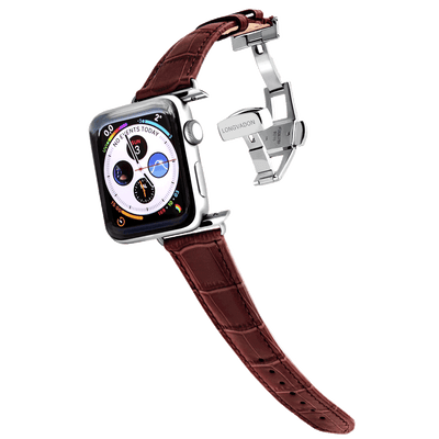 silver apple watch with mahogany brown leather band for women