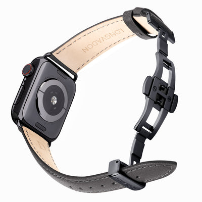 black apple watch with dark gray leather band for women back view