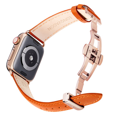 gold apple watch with whiskey brown leather band for women back view