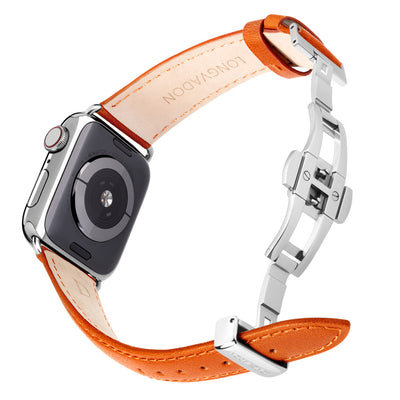 silver apple watch with whiskey brown orange leather band for women back view